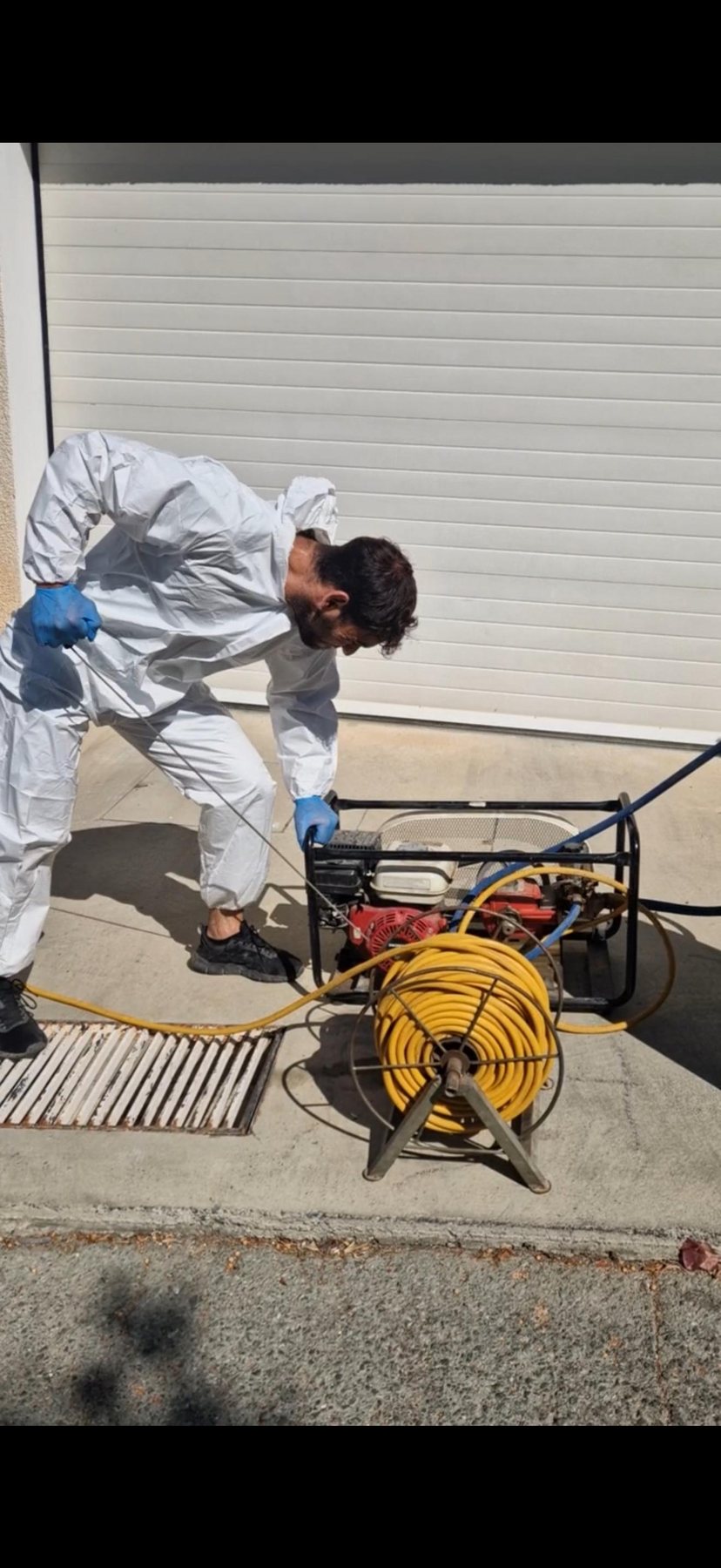 PPS technician in protective clothing carrying out a treatment